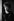 Ein schwarz-weiß Porträt der Fotografin Helga Paris mit dem Titel "Keule" zeigt einen jungen Mann mit Nieten-besetzter Lederjacke, der in einem Türrahmen lehnt und in die Kamera schaut