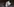 eine Maske liegt auf der Straße im Dreck