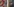 Wandbilder an zwei Plattenbauten zeigen Gesichter und Vögel