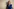 Kristina Lunz steht vor einer hellen Wand