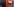 Ein roter Geldautomat.