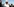Idriss Deby lächelt in weißem Gewand und mit weißer Kopfbedeckung