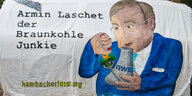 Plakat vom Hambacher Fortst gegen Armin Laschet