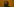 Rapper Mädness steht vor orangem Hintergrund und schaut nach oben