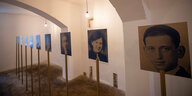Portraits von Euthanasie-Opfern in einer Gewölbehalle der Gedenkstätte Pirna-Sonnenstein