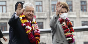 Präsident Lopez un dEx-Präsidentin Rousseff winken.