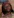 Frau mit Brille und buntem Tuch