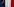 Macron tritt aus einem Vorhang in Farben der Trikolore