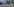 Soldaten stehem vor einem Bundeswehrflugzeug in einer Reihe und tragen Mund-Nasenschutz