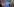 Angela Merkel spricht an einem Podeum vor blauem Hintergrund- neben ihr Deutschlandflaggen und Europaflaggen