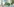 Eine Computeranimation zeigt ein modernes Gebäude mit einer spitz zulaufenden Form..