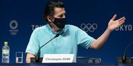 IOC-Olympiadirektor mit Maske.
