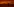Person läuft durch Rauch, der Himmel ist von Feuern rot gefärbt.