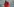 Eine Person mit roter Windjacke und Sturmhaube
