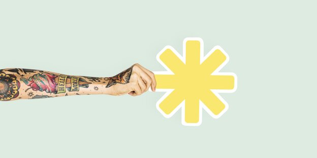 Eine tätowierte Hand hält ein gelbes Sternchen