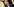 Präsident Hörmann, im Hintergrund Kleidungsstücke an Kleiderbügeln
