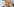 Friedrich Merz greif sich mit seiner linken Hand an sein linkes Auge