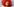 Die:der Musiker:in Genesis P-Orridge trägt eine Kopfbedeckung aus rotem Tüll und blickt in die Kamera