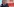 Peter Tschentscher umarmt Olaf Scholz vor einem SPD-Logo