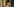 Porträtfoto von Tara Nome Doyle, die in Gedanken versunken nach unten blickt