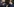 Olaf Scholz und Emmanuel Macron tragen Anzug und Mundschutz und machen freundliche Gesten