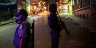 Zwei Männer in Uniform stehen nachts mit Waffen auf der Straße