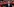 Richard Lutz steht im Anzug lachend vor einem Zug