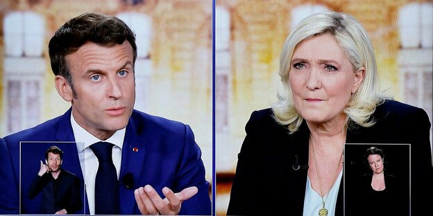 Eine Bildschirm mit den Gesichteren von Emmanuel macron und Marine Le Pen