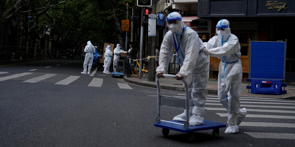 people in protective suits