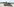 Ein Panzer steht in einer sommerlichen Landschaft