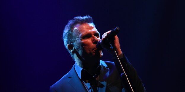 Singer and composer Cathal Coughlan at the microphone