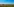 Landschaft mit Feldern und Mohnblumen, blauem Himmel und Windrädern.