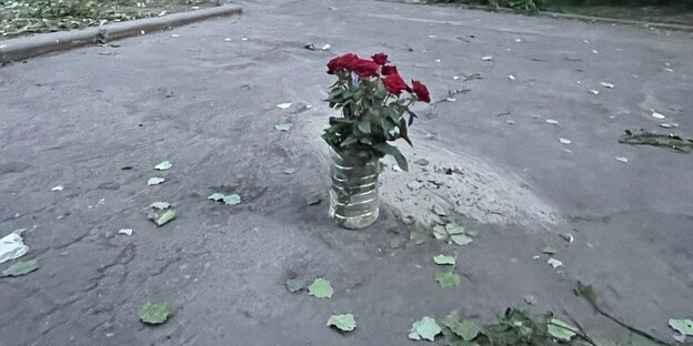 A bouquet of red roses on a street