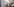 Teilnehmer an der Demonstration "Lindner raus - Umverteilung jetzt!" stehen mit Plakaten an der FDP-Bundesgeschäftsstelle. Auf dem Plaket steht "Kein Templimit für Lindner-Rücktritt"