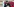 Ferat Kocak spricht in ein Mikrofon. Hinter ihm ist ein Transparent zu sehen
