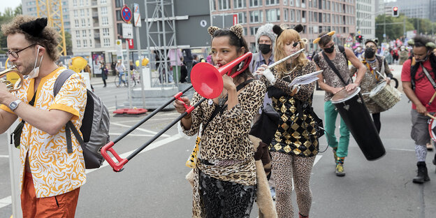 People demonstrate with musical instruments