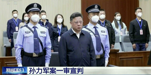 A screenshot from a video broadcast by Chinese broadcaster CCTV shows Sun Lijun, former vice minister of public security, delivering the verdict