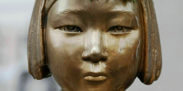 A detail of a Comfort Woman statue