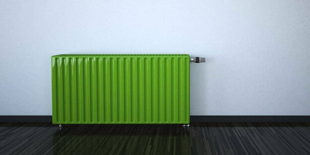 Elektrischer Radiator in Grün steht an der Wand in einem Zimmer