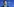 Mann mit Schlips vor einer blauen Wand