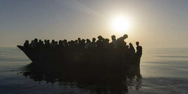 Boat with refugees on the Mediterranean Sea