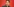 Portrait von Kevin Kühnert vor rotem Hintergrund