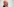 Älterer, weißer Mann mit Glatze und Brille sitzt im Potsdamer Landtag