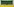 Ein Mann wischt eine grüne Tafel vor leeren Sitzen in einem Hörsaal