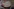 Eine bunt gemusterte Keramikschale steht auf dem Schreibtisch von Ulrike Kremeier, eine Schale für Kekse