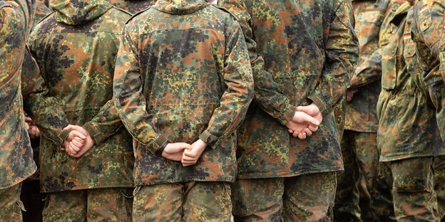 Bundeswehr soldiers stand together
