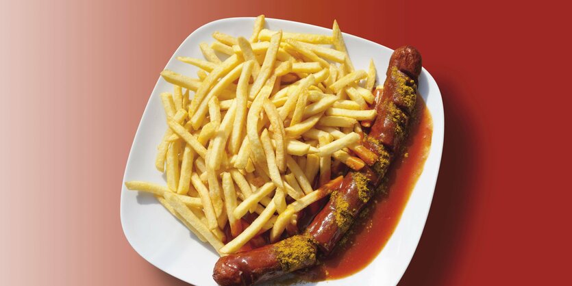 Eine Currywurst auf einem Teller