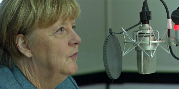 Ex-Chancellor Angela Merkel speaks in a studio