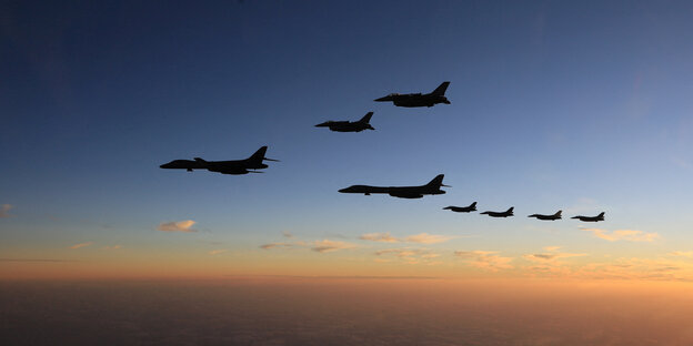Military jets fly in a formation