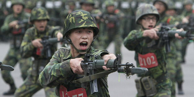 Uniformed with weapons in training